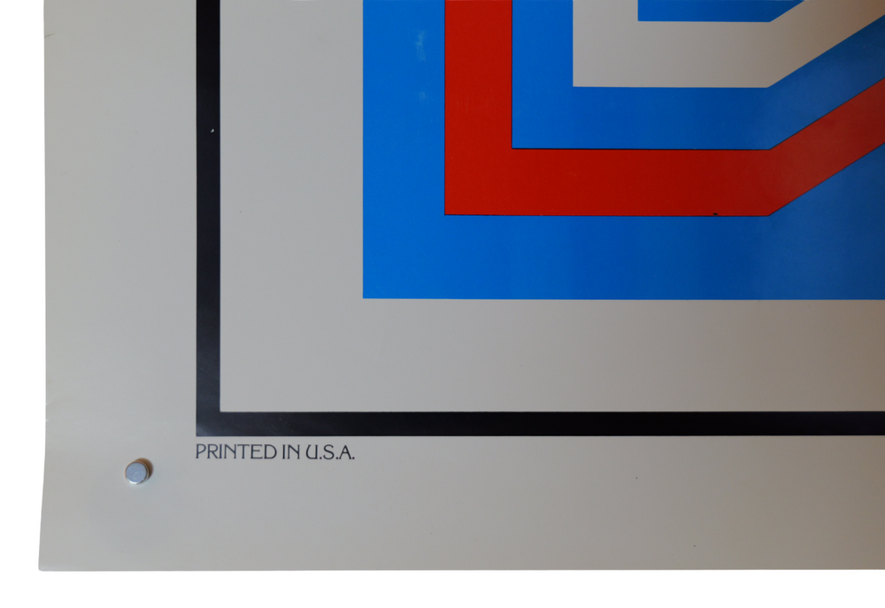 Close-up of a graphic design with red and blue shapes on a white background, featuring 'Printed in U.S.A.' text.