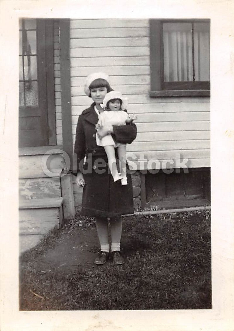 Cute Little Girl and Her Toy Doll Out Front Vintage 1940s Snapshot Photo